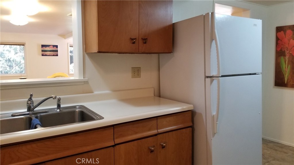 21455 Delta Way, Unit 2 Monte Rio, CA 95462 - Photo 21 of 48 a kitchen with a sink and a refrigerator
