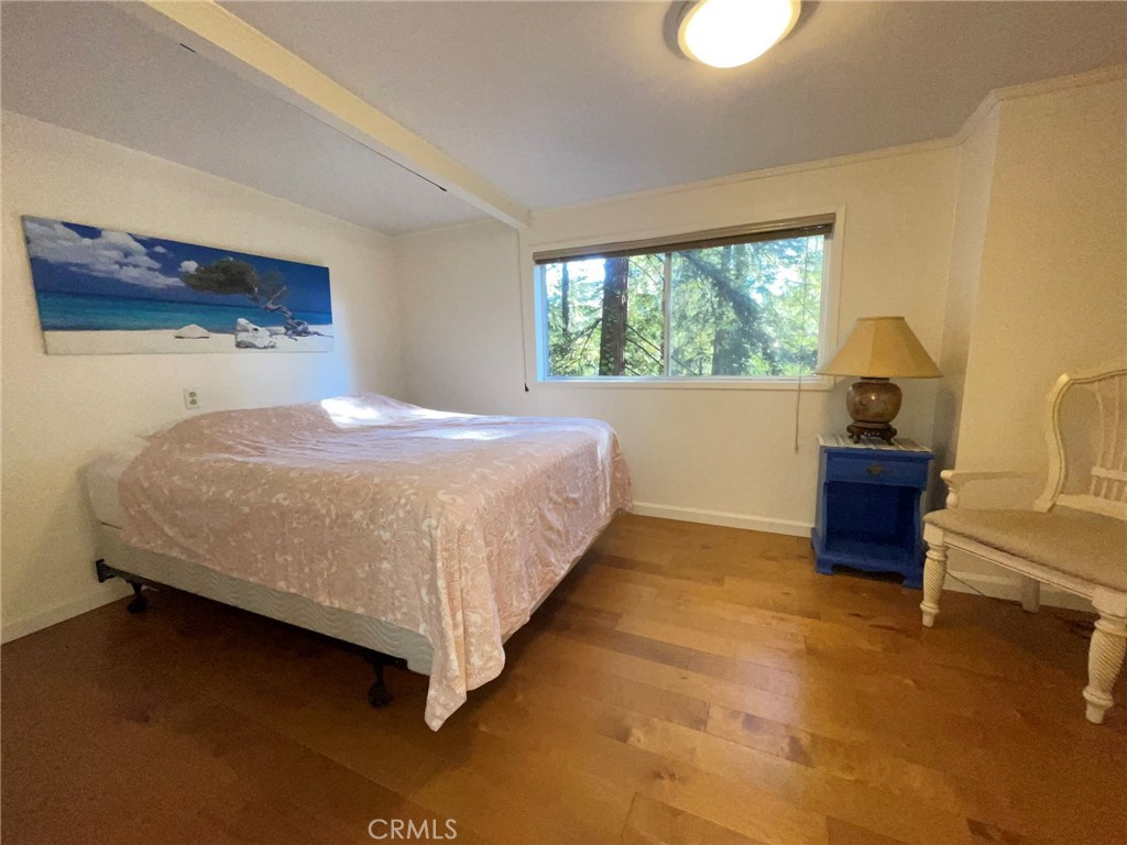 21455 Delta Way, Unit 2 Monte Rio, CA 95462 - Photo 32 of 48 a bedroom with a bed and a couch