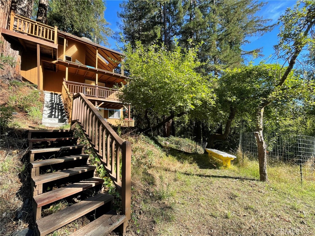 21455 Delta Way, Unit 2 Monte Rio, CA 95462 - Photo 42 of 48 a view of a house with backyard and wooden fence