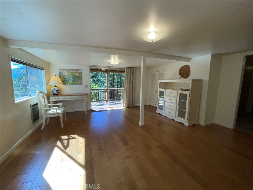 21455 Delta Way, Unit 2 Monte Rio, CA 95462 - Photo 6 of 48 a living room with furniture and a fireplace