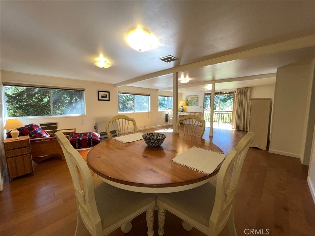 21455 Delta Way, Unit 2 Monte Rio, CA 95462 - Photo 8 of 48 a view of a dining room with furniture and wooden floor