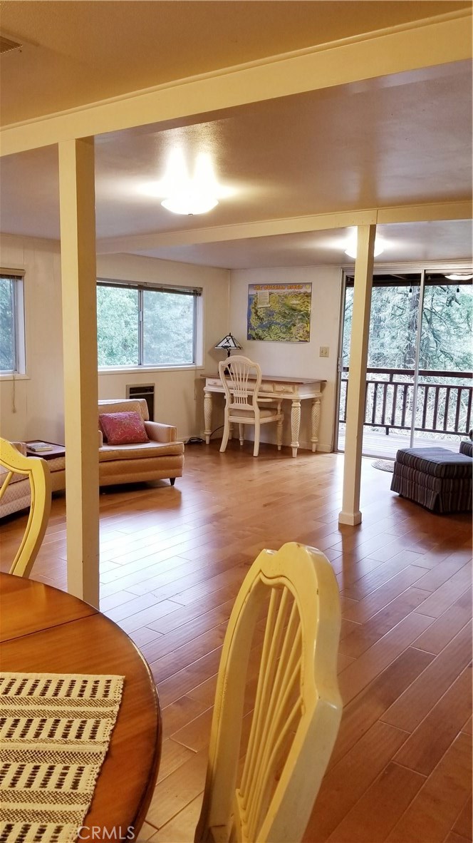 21455 Delta Way, Unit 2 Monte Rio, CA 95462 - Photo 9 of 48 a bedroom with furniture and a wooden floor