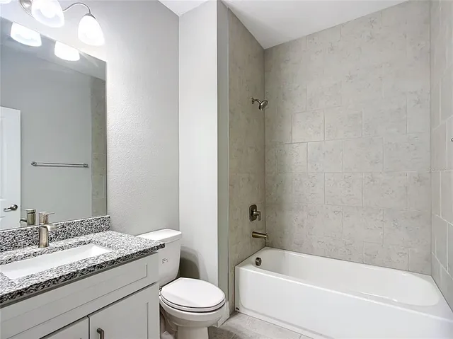 a bathroom with a sink vanity and a mirror