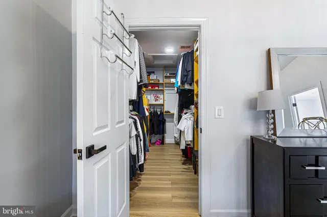 a view of a house with a large window and wooden floor