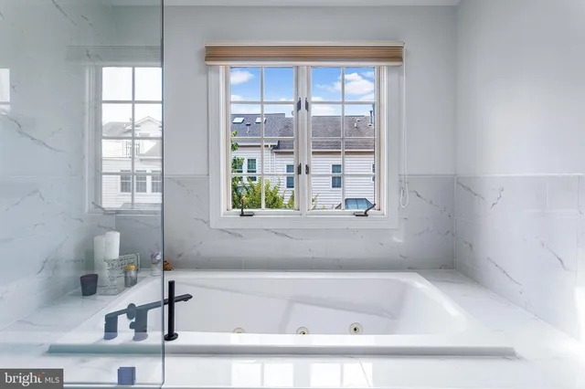 a kitchen with stainless steel appliances kitchen island granite countertop a sink and cabinets
