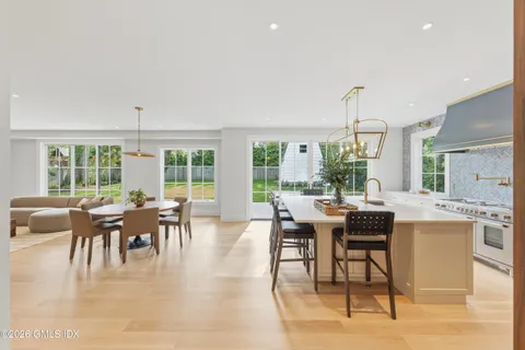 a dining room with furniture window and outside view