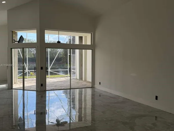 a view of empty room with windows