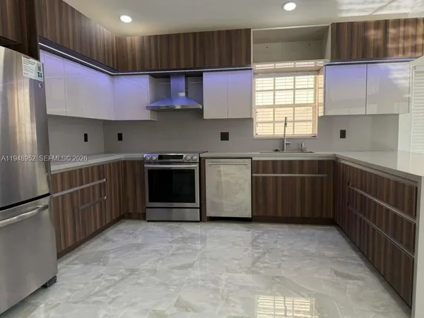a view of a livingroom with a ceiling fan and window