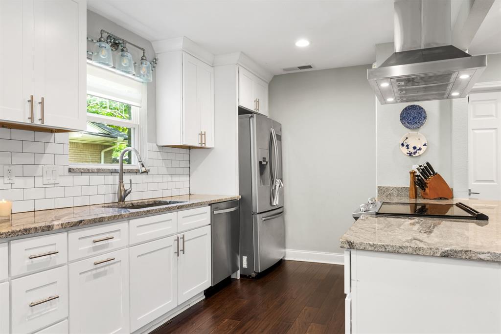 3236 Merrell Road Dallas, TX 75229 - Photo 11 of 24 a kitchen with a sink appliances and cabinets
