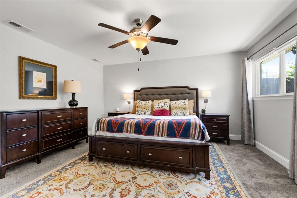 3236 Merrell Road Dallas, TX 75229 - Photo 13 of 24 a bedroom with a bed and window