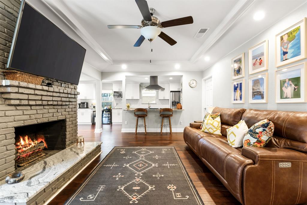 3236 Merrell Road Dallas, TX 75229 - Photo 3 of 24 a living room with furniture and a fireplace
