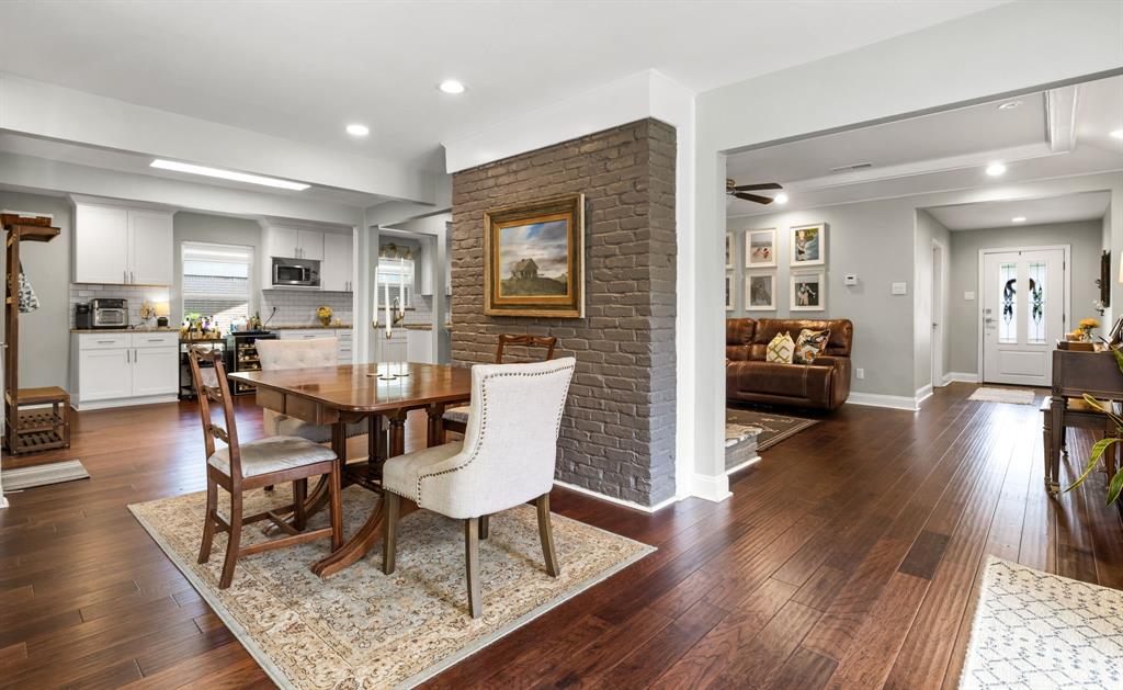 3236 Merrell Road Dallas, TX 75229 - Photo 7 of 24 a view of a dining room with furniture and wooden floor