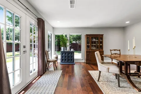 a view of a livingroom with furniture window and wooden floor