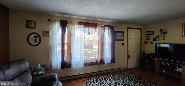 a view of a livingroom with furniture and windows