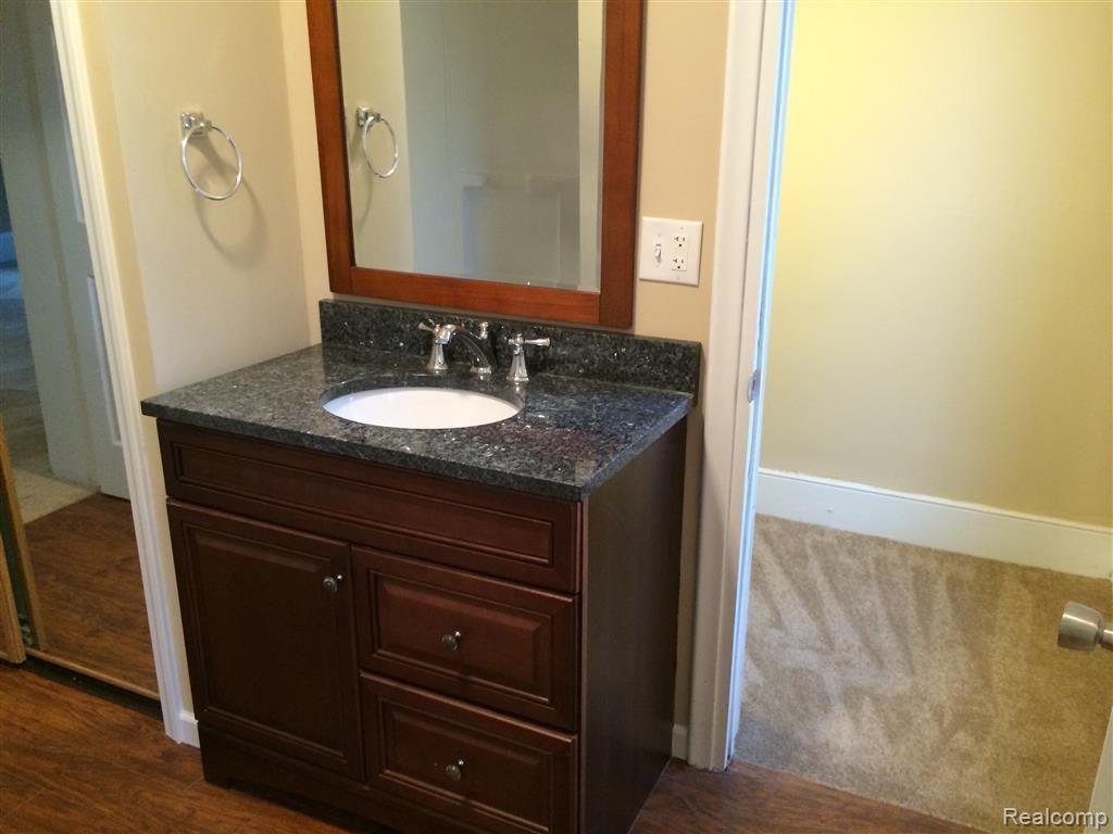 923 Jones Street Howell, MI 48843 - Photo 16 of 27 First floor bathroom with gorgeous vanity.