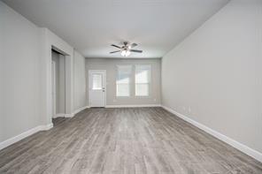 254 Lunayena Road Rhome, TX 76078 - Photo 4 of 8 wooden floor in an empty room with a window