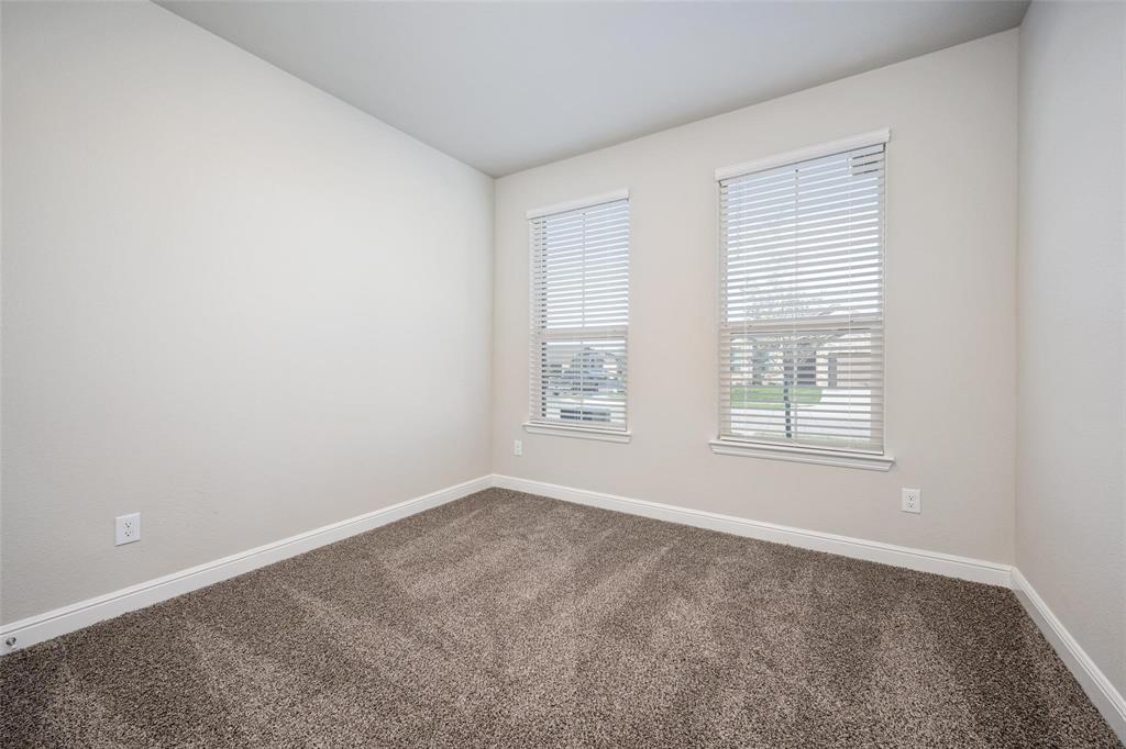 254 Lunayena Road Rhome, TX 76078 - Photo 5 of 8 an empty room with a window
