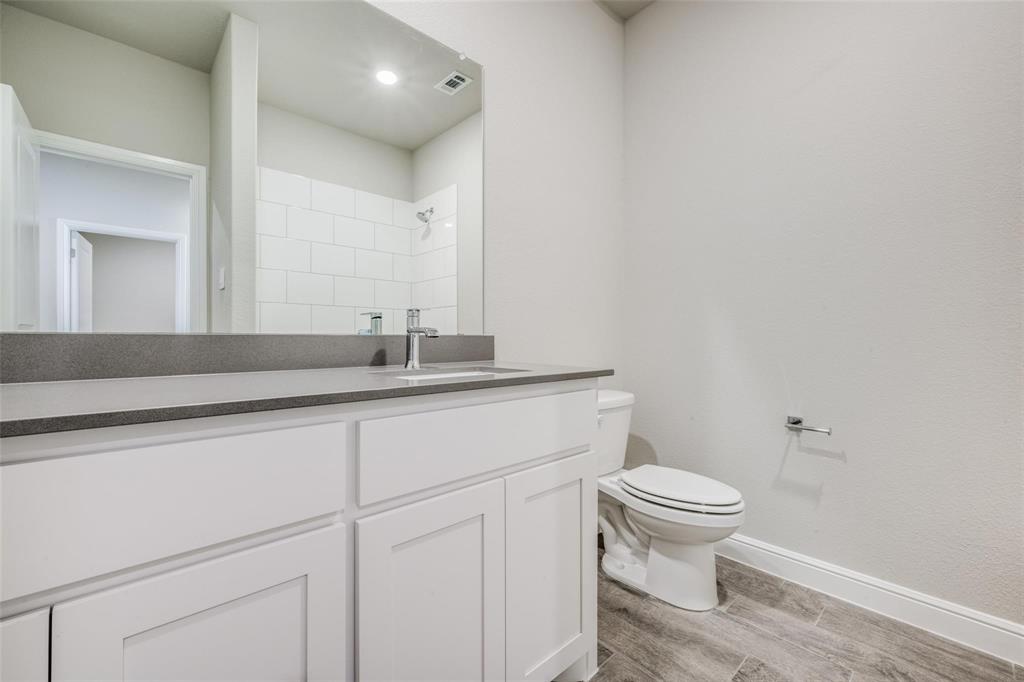 254 Lunayena Road Rhome, TX 76078 - Photo 6 of 8 a bathroom with a sink and a toilet