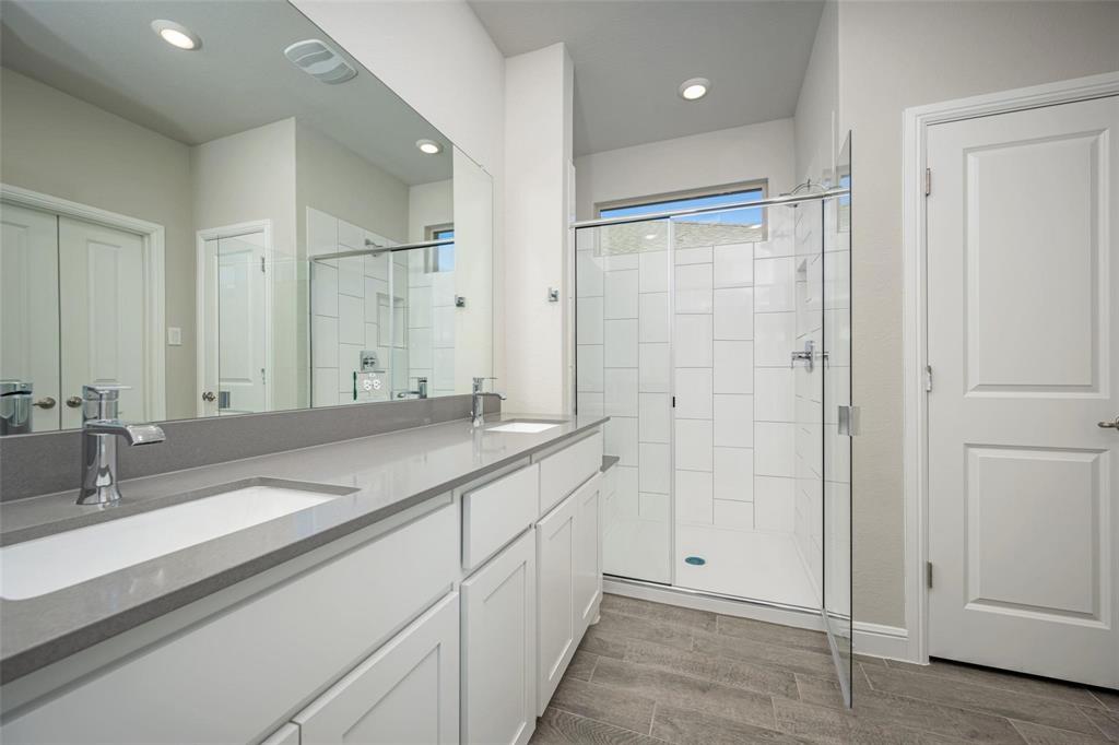 254 Lunayena Road Rhome, TX 76078 - Photo 8 of 8 a bathroom with double sink and a mirror