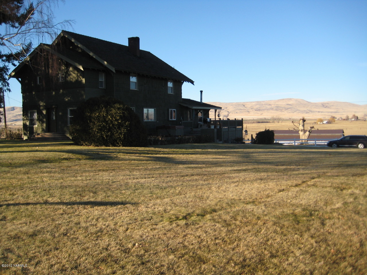 6591 West Wapato Road Wapato, WA 98951 - Photo 2 of 46 a view of swimming pool of the house with a yard