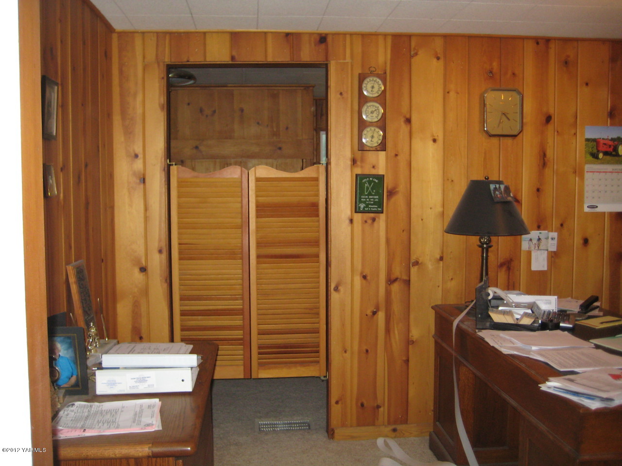 6591 West Wapato Road Wapato, WA 98951 - Photo 14 of 46 a room with a door and a table