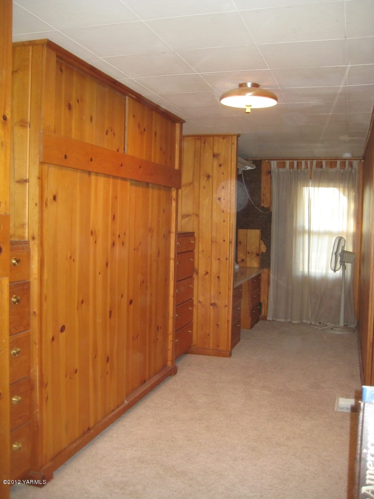 6591 West Wapato Road Wapato, WA 98951 - Photo 17 of 46 an empty room with windows