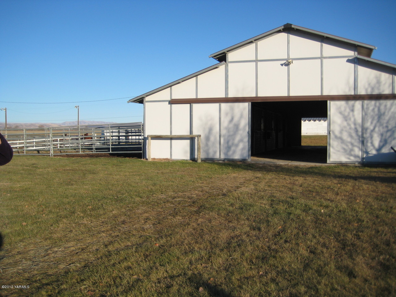 6591 West Wapato Road Wapato, WA 98951 - Photo 27 of 46 a view of a house with a yard