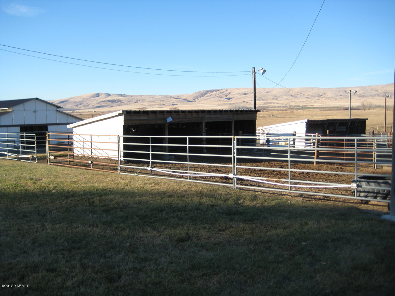 6591 West Wapato Road Wapato, WA 98951 - Photo 33 of 46 a view of a house with a yard