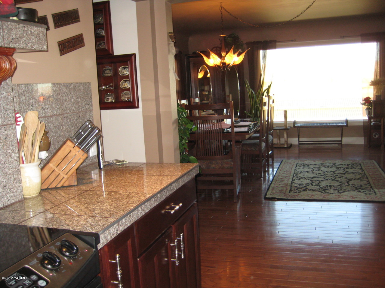 6591 West Wapato Road Wapato, WA 98951 - Photo 5 of 46 a kitchen with counter top space and stove
