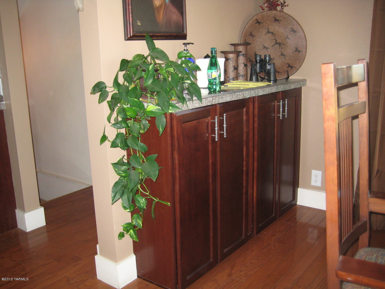 6591 West Wapato Road Wapato, WA 98951 - Photo 6 of 46 a flower pot with wooden floor