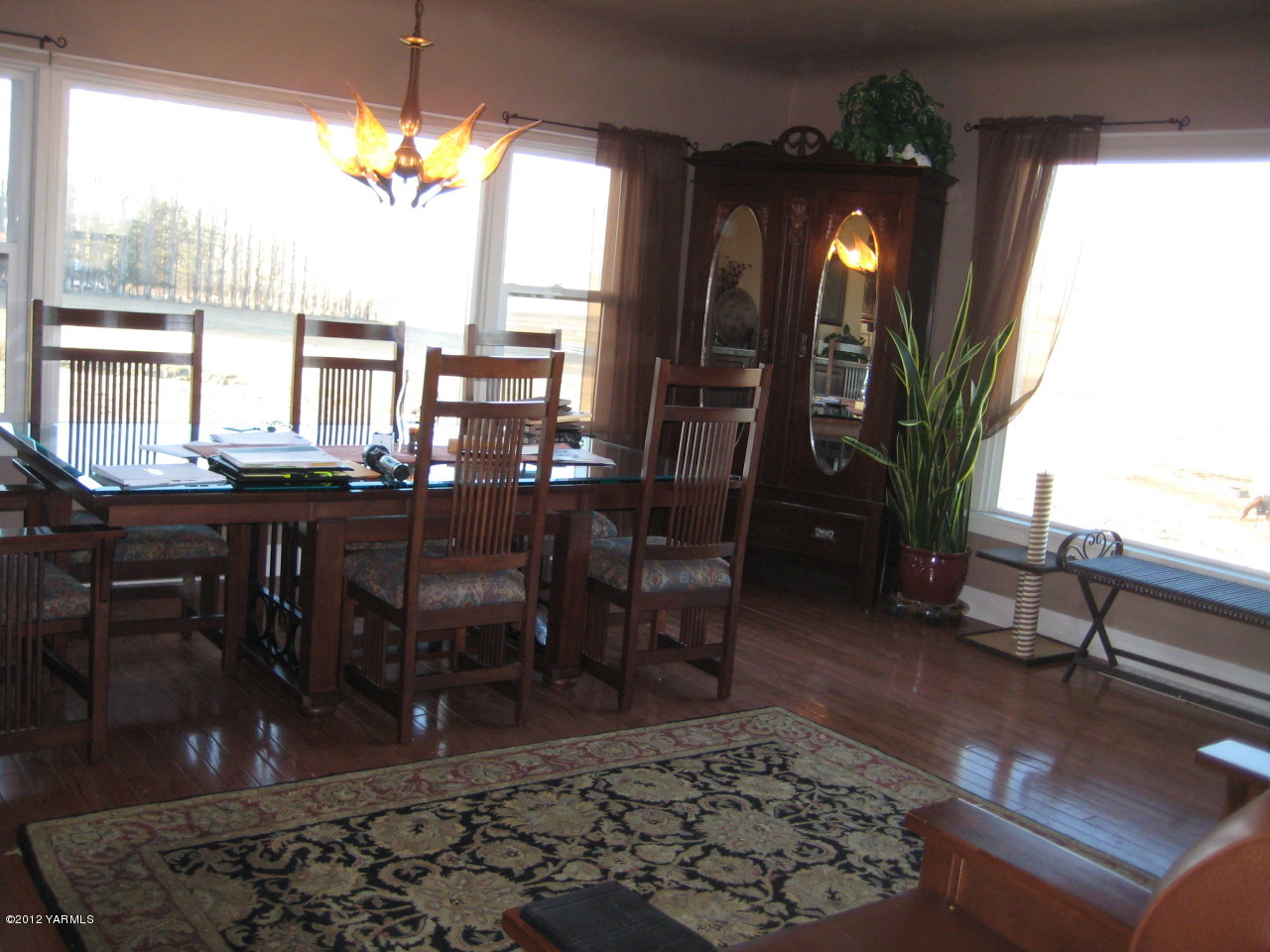 6591 West Wapato Road Wapato, WA 98951 - Photo 7 of 46 a view of a dining room with furniture and chandelier