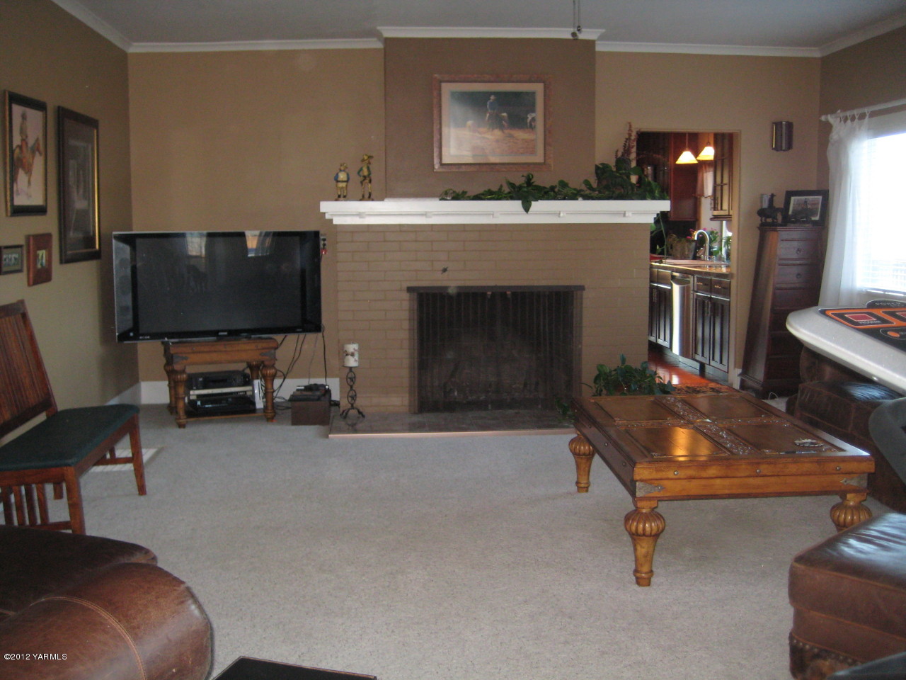 6591 West Wapato Road Wapato, WA 98951 - Photo 9 of 46 a living room with furniture and a fireplace