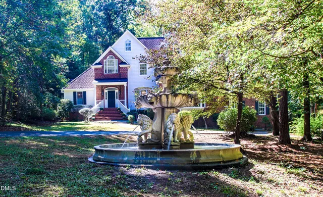 a view of a swimming pool with a yard