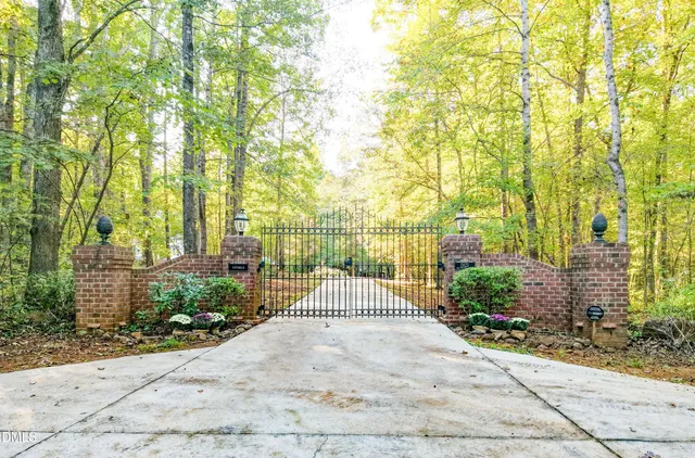a view of a dining room with furniture a chandelier and wooden floor