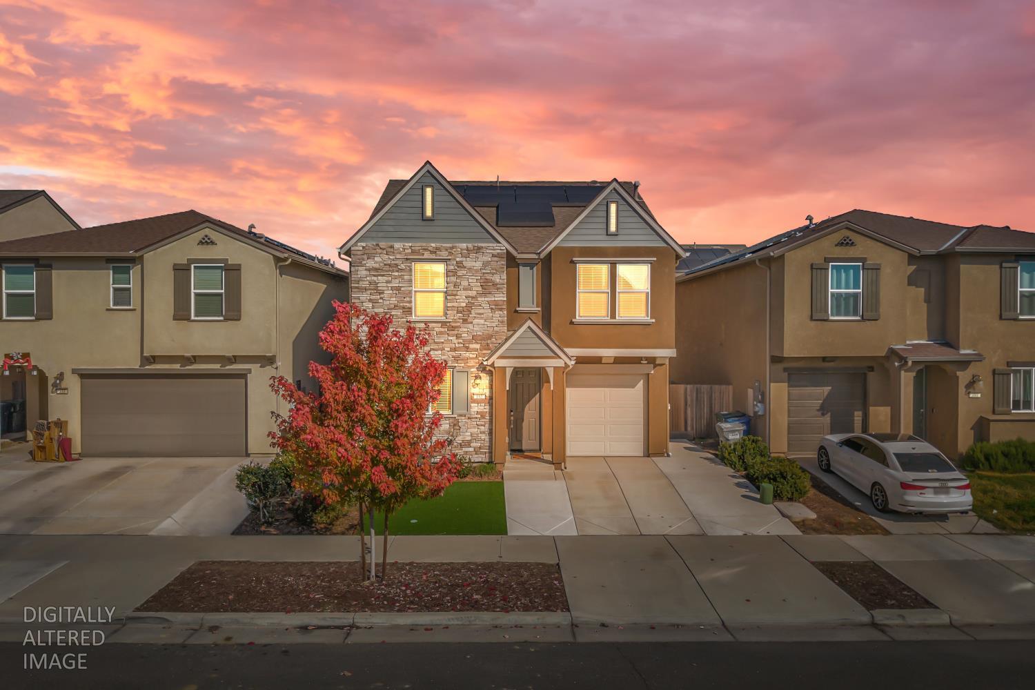 a front view of a house with garden