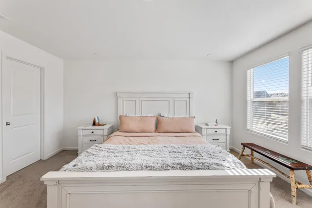 a bedroom with a bed and a dresser