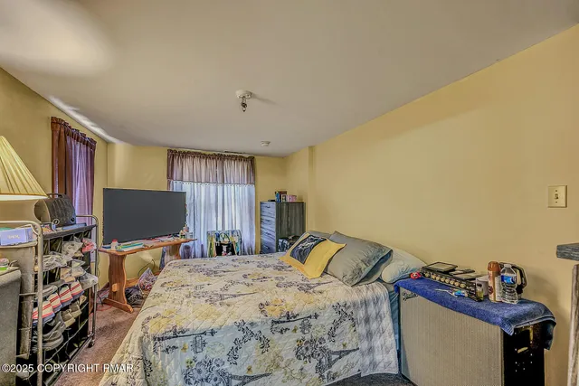 a view of a room that has a window in it