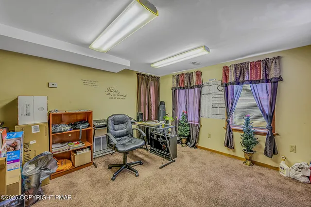 a view of empty room with windows