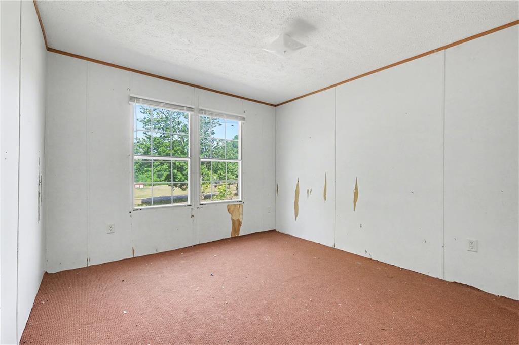 249 John Golden Road Temple, GA 30179 - Photo 39 of 45 an empty room with a window