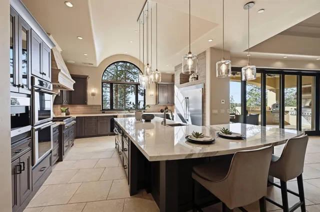 a bedroom with a large bed and a flat screen tv