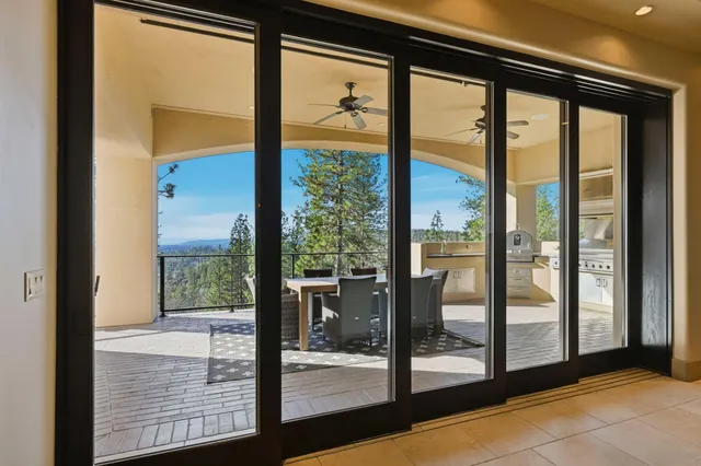 a kitchen with a refrigerator and a chandelier