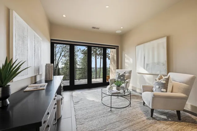 a view of a dining room with furniture window and outside view