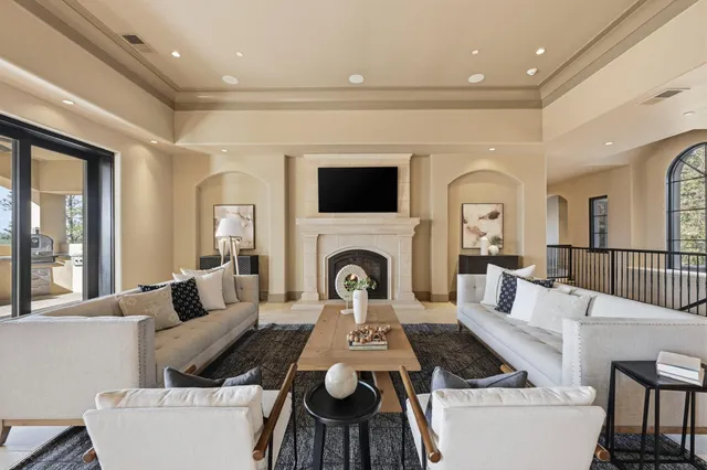 a view of a dining room with furniture chandelier and wooden floor