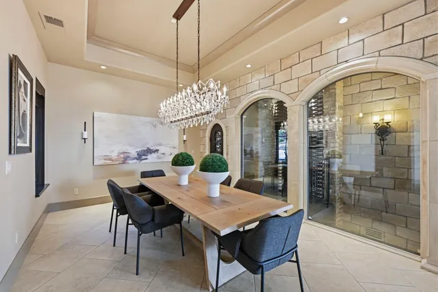 a living room with patio furniture and a fireplace