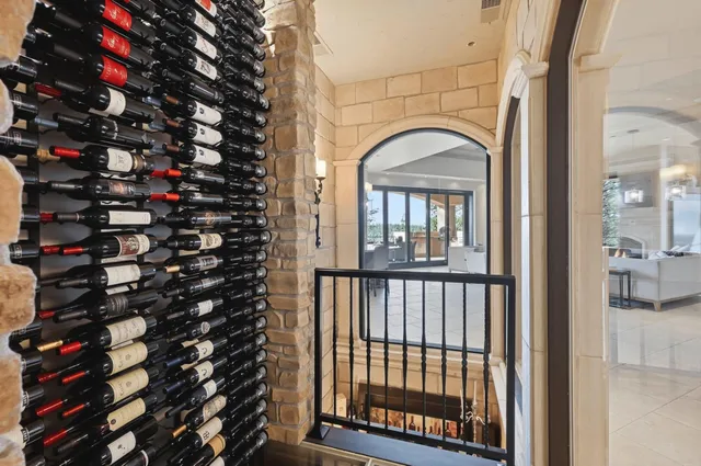 a kitchen with stainless steel appliances a sink a stove a counter space and a window