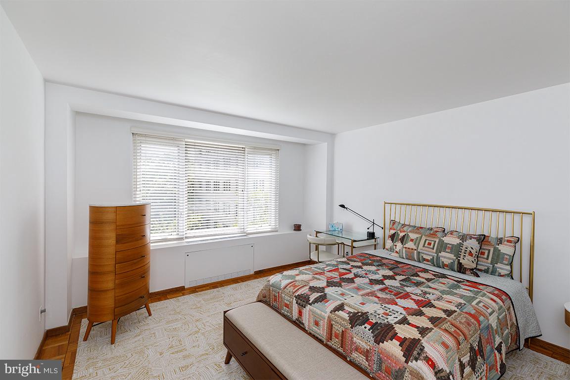 2475 Virginia Avenue Northwest, Unit 515 Washington, DC 20037 - Photo 11 of 22 a bedroom with a bed and a window