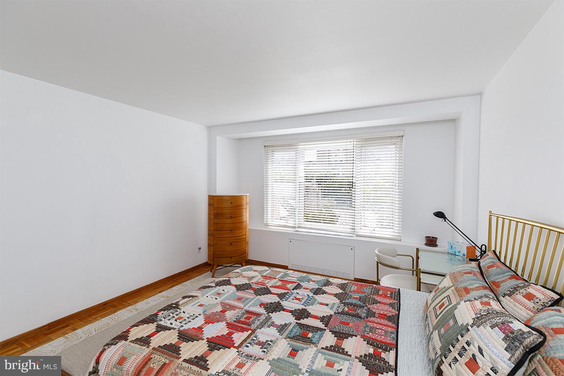 2475 Virginia Avenue Northwest, Unit 515 Washington, DC 20037 - Photo 12 of 22 a bedroom with a bed and a window