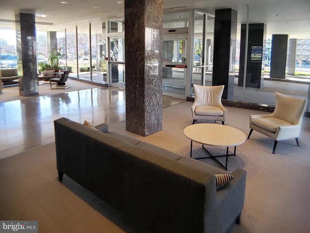 2475 Virginia Avenue Northwest, Unit 515 Washington, DC 20037 - Photo 21 of 22 a living room with couches and a coffee table with garden view