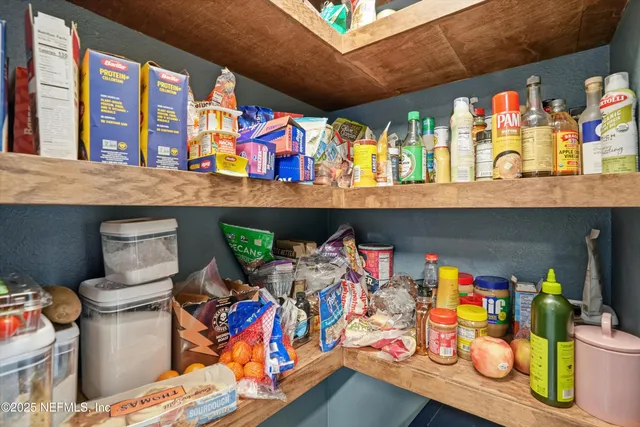 a group of people sitting in front of retail shop