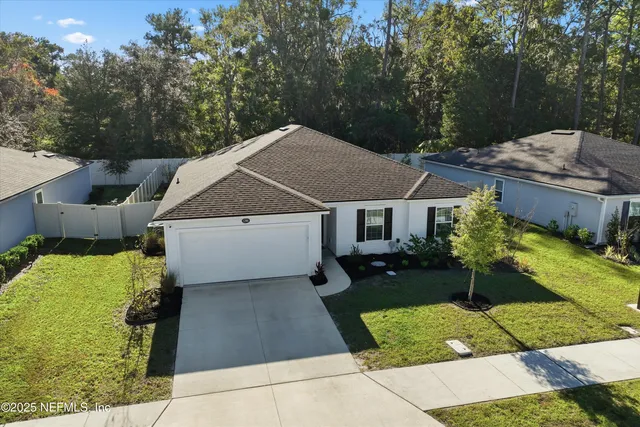 a view of house with a swimming pool